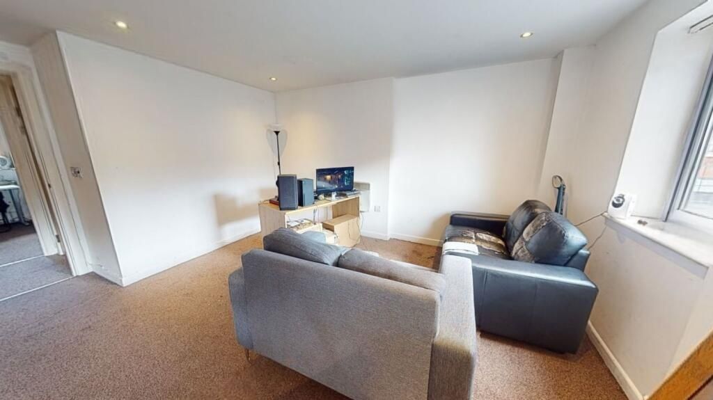 Property photo 1 of 5 Bright And Inviting Living Room Featuring Comforta...