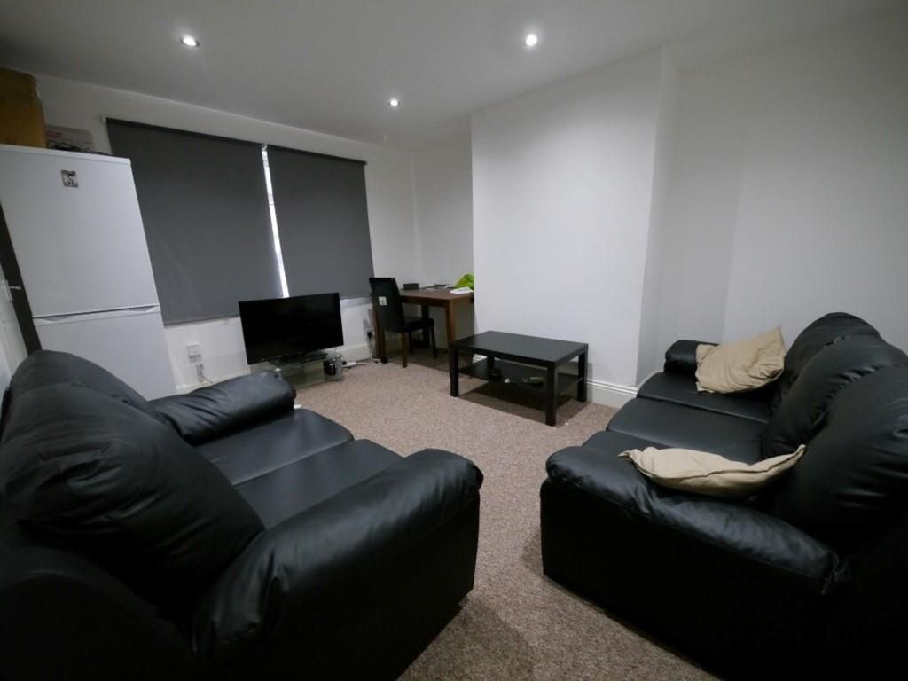 Property photo 3 of 6 Cozy Living Room Featuring Two Black Leather Sofas...