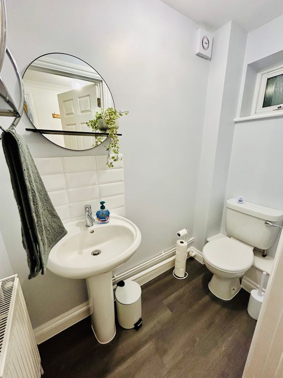 Property photo 2 of 11 A Modern And Clean Bathroom Featuring A Stylish Si...