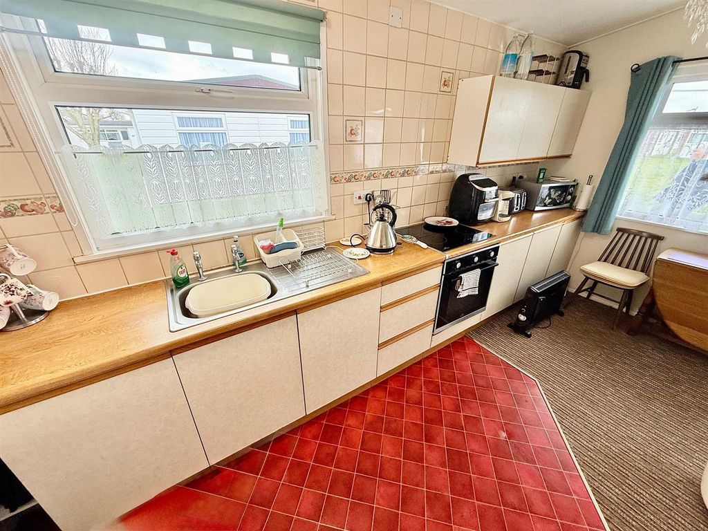 Property photo 3 of 12 Kitchen Area