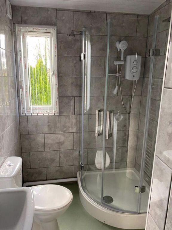 Property photo 3 of 13 A Modern Bathroom Suite Featuring A Curved Glass S...