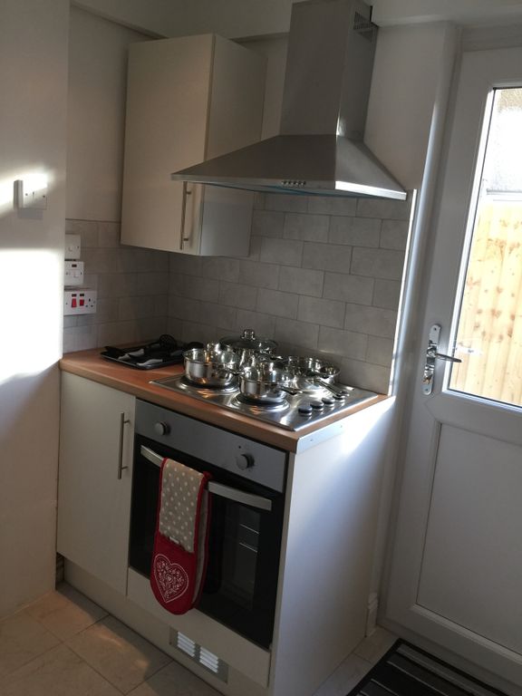 Property photo 3 of 4 Bright And Modern Kitchen Featuring A Sleek Design...
