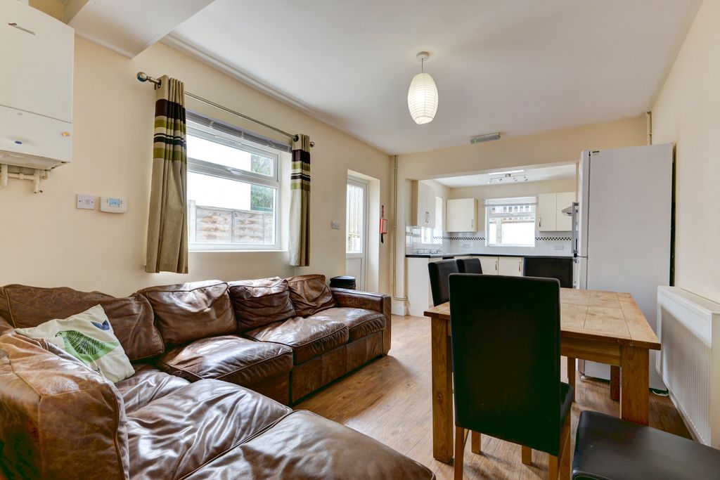 Property photo 3 of 24 A Bright And Welcoming Living Room Featuring A Lar...