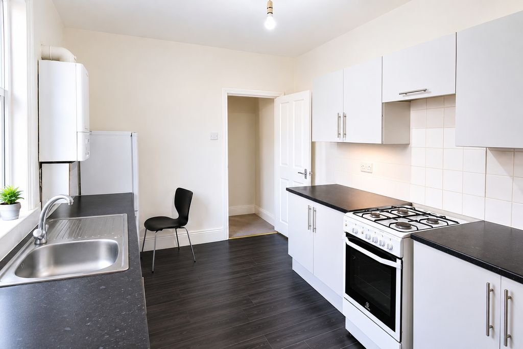 Property photo 3 of 4 Bright Modern Kitchen With Sleek White Cabinets...
