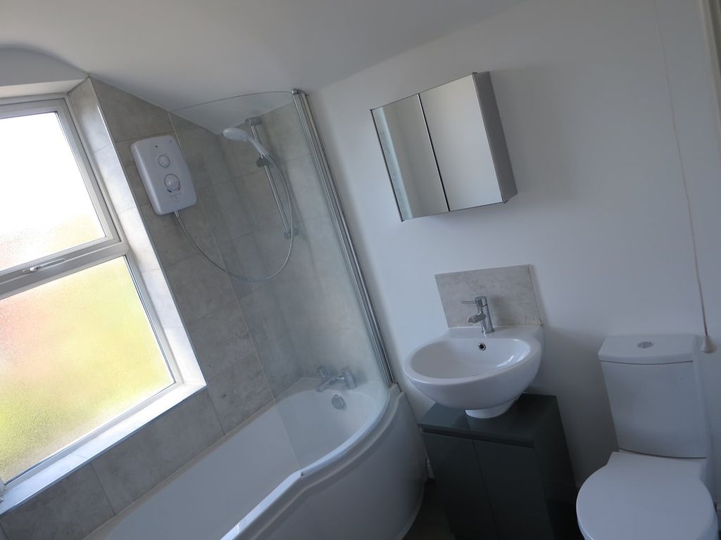 Property photo 3 of 9 Bright And Modern Bathroom Suite Featuring A Curve...