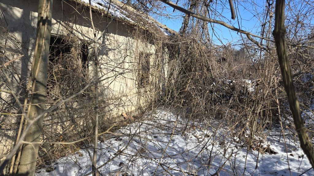 Property photo 2 of 20 Side View Of An Old House With Bare Trees And Snow-Covered Ground In Winter.