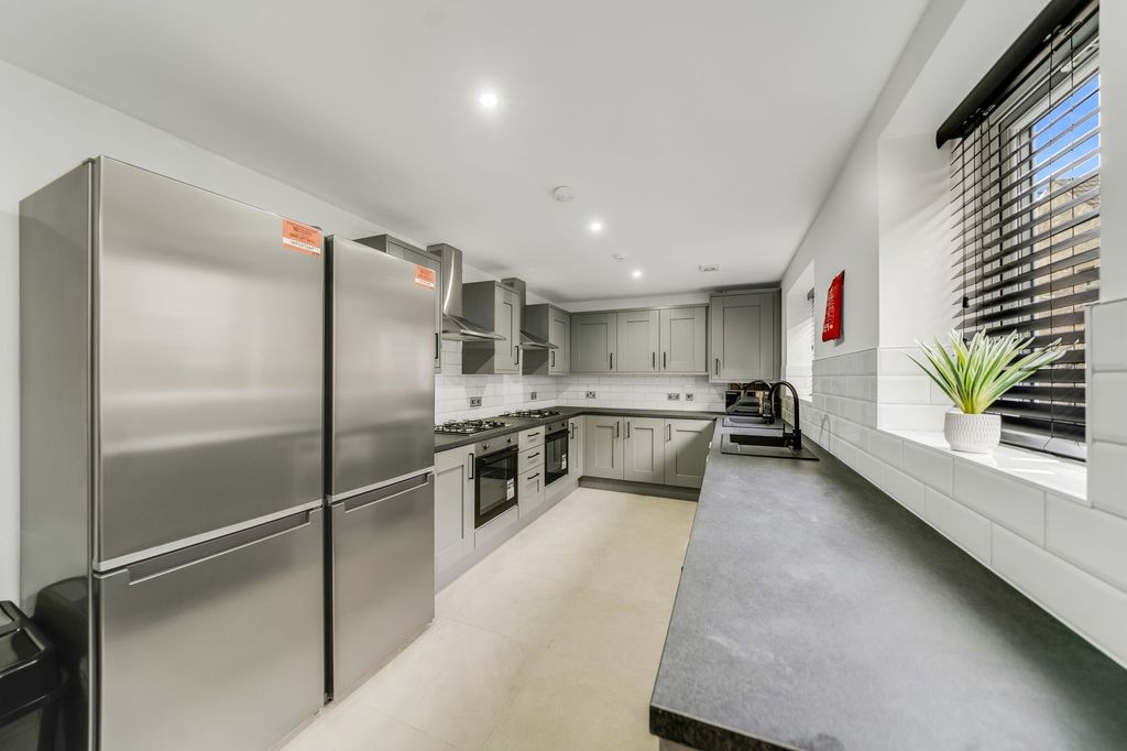 Property photo 1 of 4 Modern And Sleek Kitchen Featuring Stainless Steel...