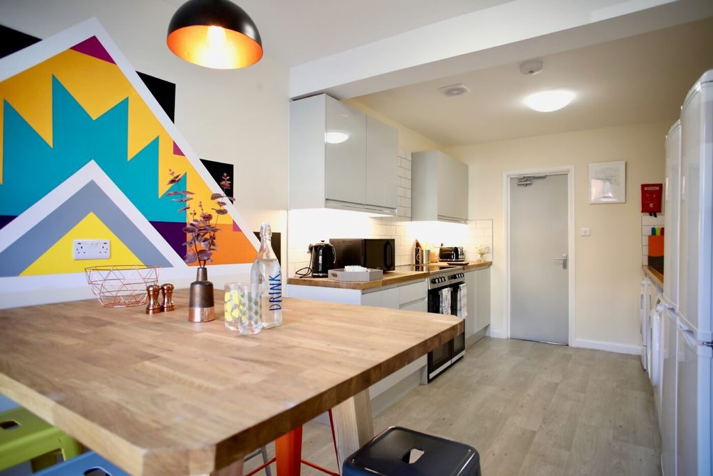 Property photo 3 of 5 Bright, Modern Kitchen With A Large Wooden Breakfa...