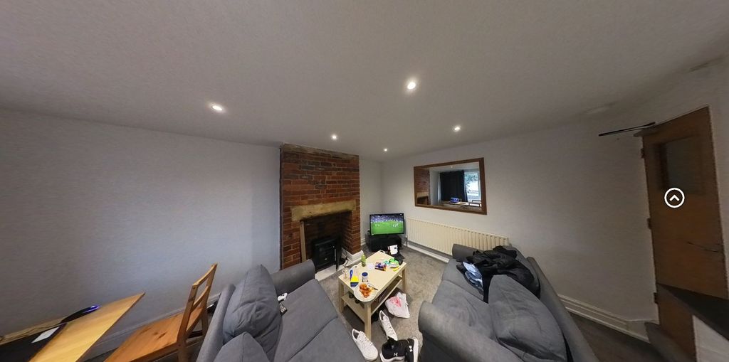 Property photo 1 of 23 A Spacious And Inviting Living Room With Modern Fu...