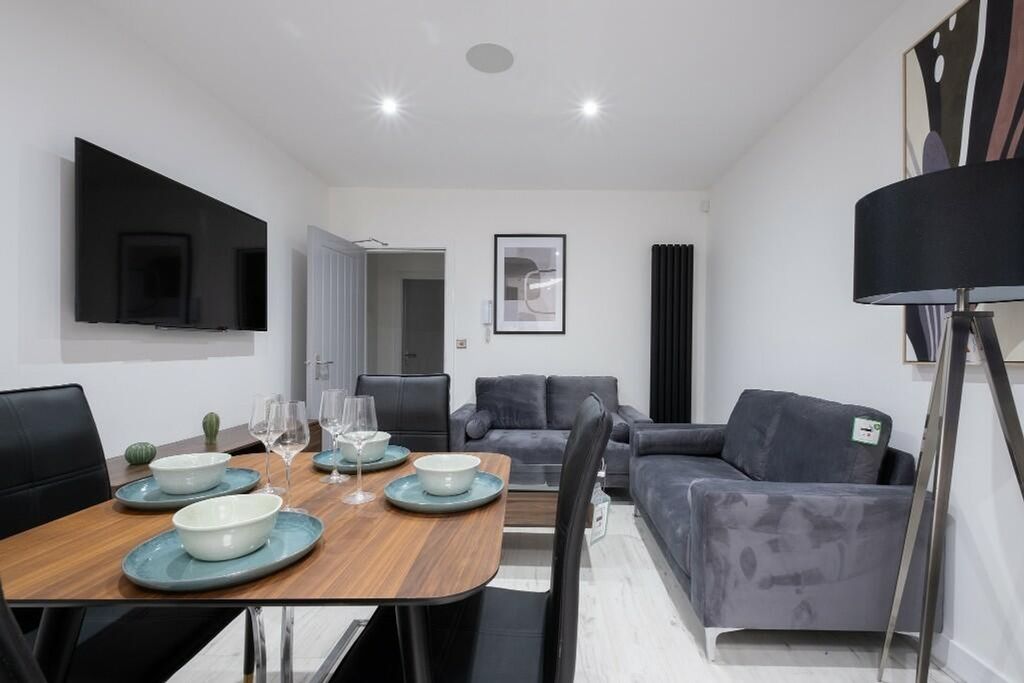 Property photo 2 of 11 Contemporary Living Room Featuring A Stylish Dinin...