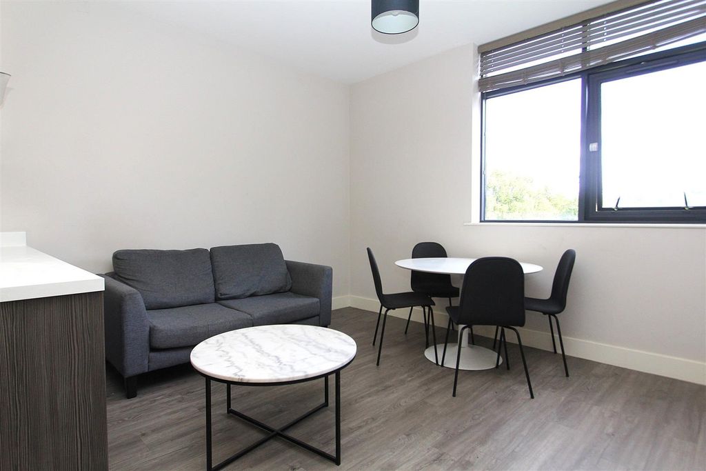 Property photo 2 of 7 Modern Living Area With Stylish Dining Set...