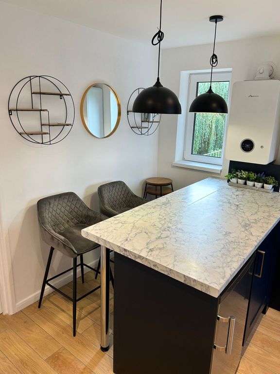 Property photo 3 of 8 Living Room + Kitchen