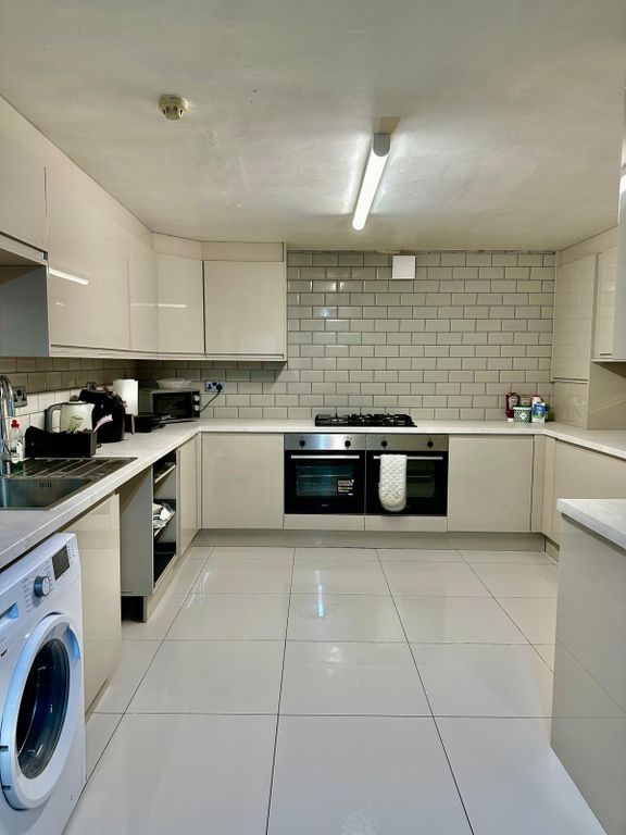 Property photo 3 of 30 A Clean And Modern Kitchen With Bright Lighting, F...