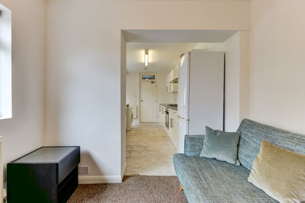 Property photo 1 of 15 A Bright And Welcoming Living Room Featuring A Com...