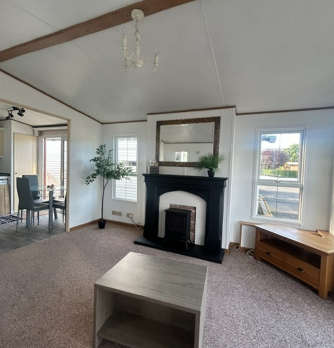 Property photo 2 of 4 Abi Westwood Living Room With Feature Fireplace, Large Mirror And Coffee Table