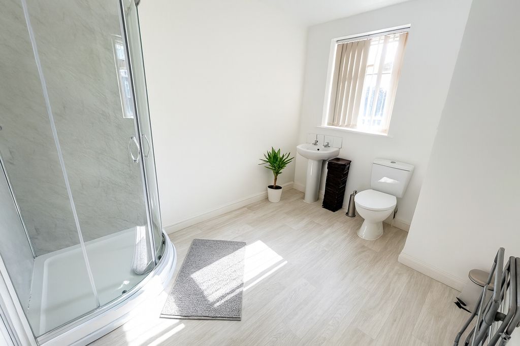 Property photo 2 of 6 Bright And Clean Bathroom With A Corner Shower Uni...