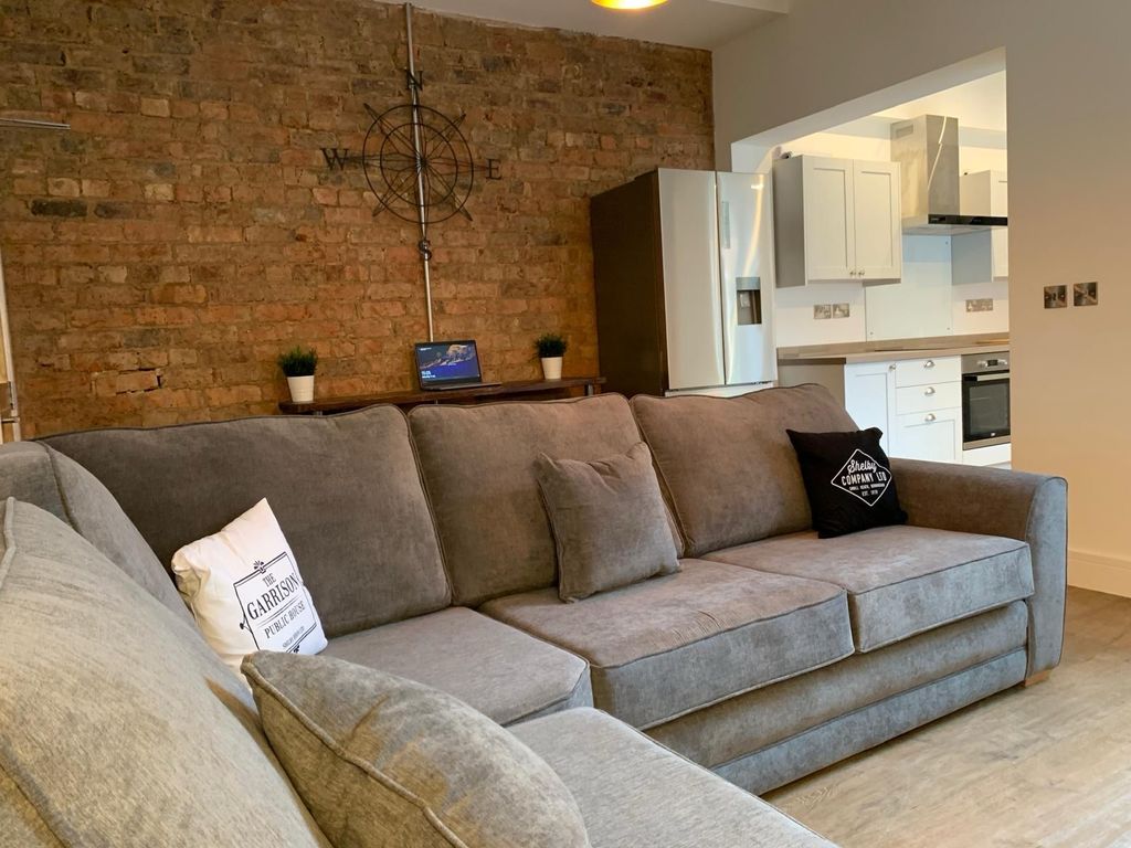 Property photo 3 of 8 A Spacious, Well-Maintained Living Room With A Lar...