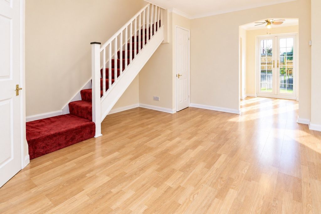 Property photo 2 of 10 Sunlit Hallway With Burgundy Staircase