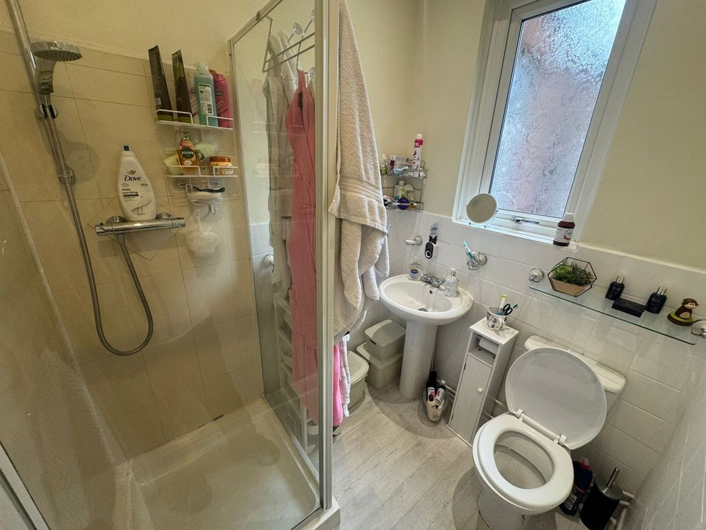 Property photo 2 of 8 Bright And Well-Maintained Bathroom Featuring A Sp...