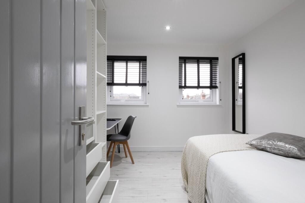 Property photo 1 of 10 A Bright And Tidy Bedroom Featuring A Comfortable ...
