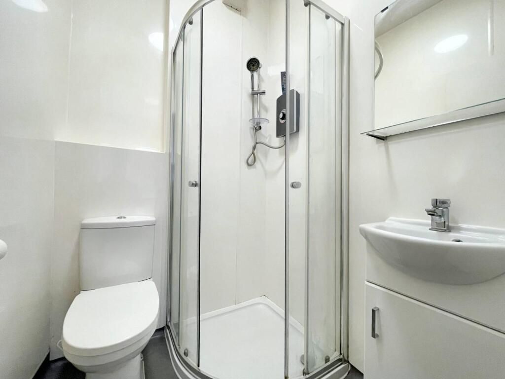 Property photo 2 of 5 A Clean And Modern Bathroom Featuring A Shower Uni...