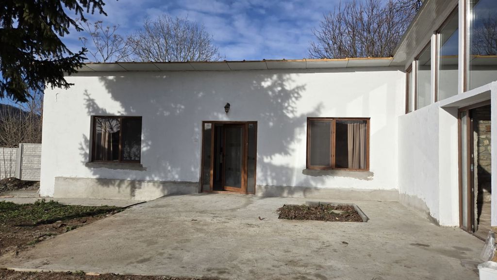 Property photo 2 of 50 Main Entrance Area Featuring A Glass Door And Two Windows On White Walls