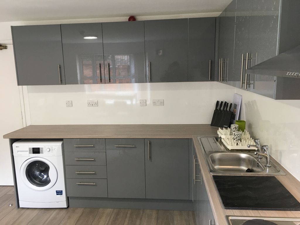 Property photo 2 of 13 A Modern And Sleek Kitchen Featuring Ample Storage...