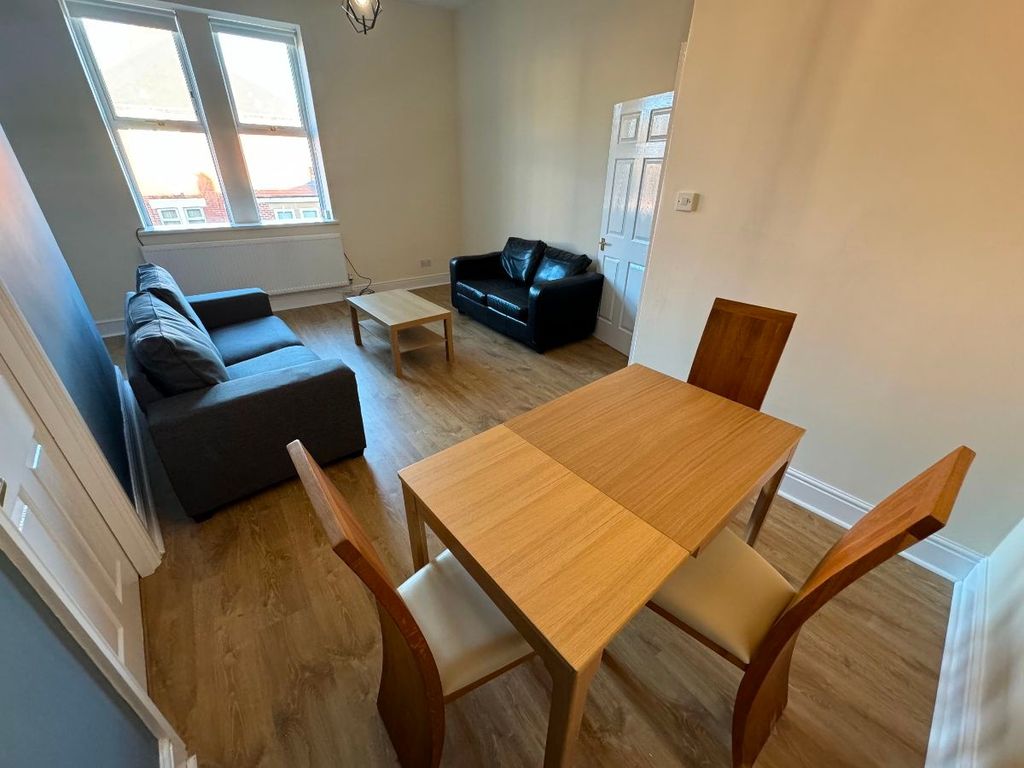 Property photo 2 of 12 A Modern Living Room Featuring Comfortable Seating...