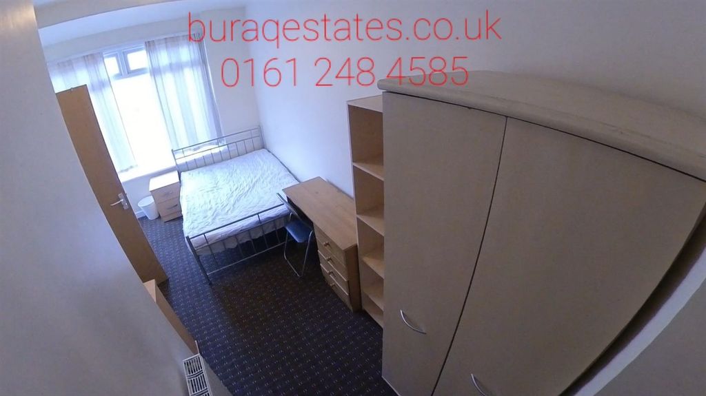 Property photo 3 of 15 A Compact, Well-Organized Bedroom Featuring A Sing...