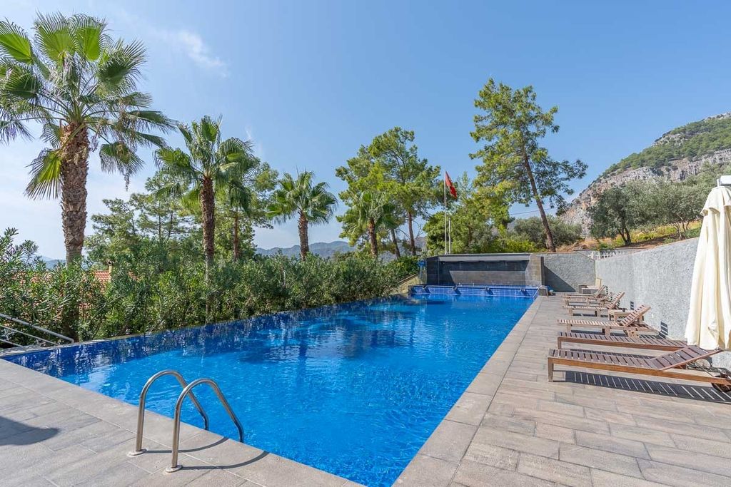 Property photo 2 of 22 A Picturesque Garden Duplex Apartment In Fethiye For Sale - Large Shared Pool And Sun Terraces