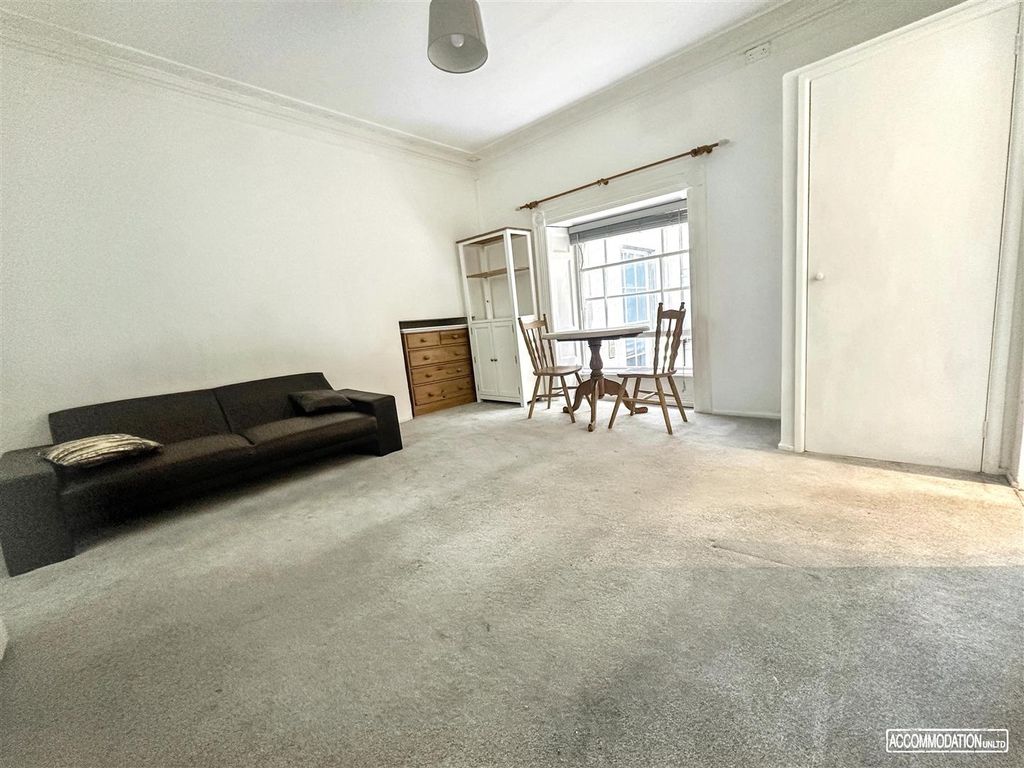 Property photo 2 of 9 Bright Living Area With Dining Set And Sofa...
