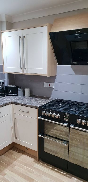 Property photo 1 of 40 Modern Corner Kitchen With A Large Gas Range And d...