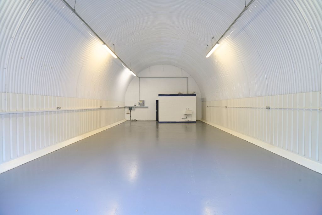 Property photo 2 of 2 An Empty Arch With White Lining And A WC Cubicle To The Back.