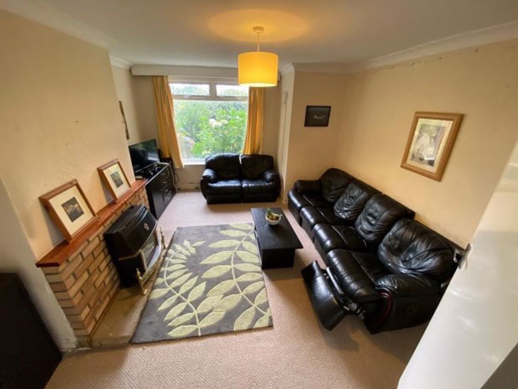 Property photo 1 of 12 A Spacious And Inviting Living Room With A Large B...