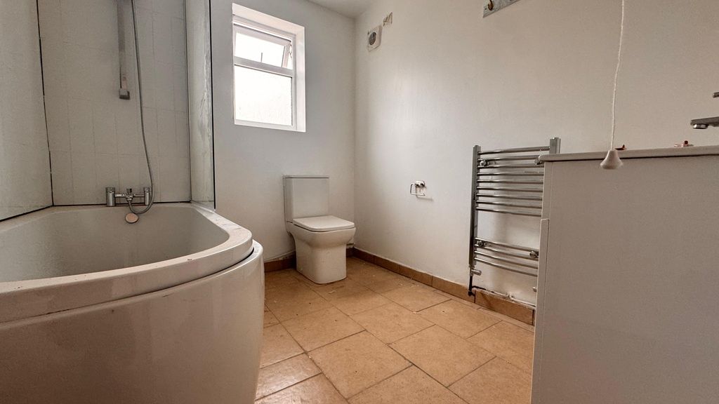 Property photo 3 of 6 Bright Bathroom With Curved Bath And Towel Rail...