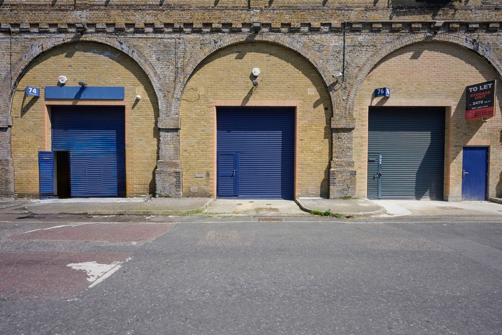 Property photo 3 of 3 The Front Of An Arch With A Closed Electric Roller Shutter Entrance Big Enough For Vehicle Access.