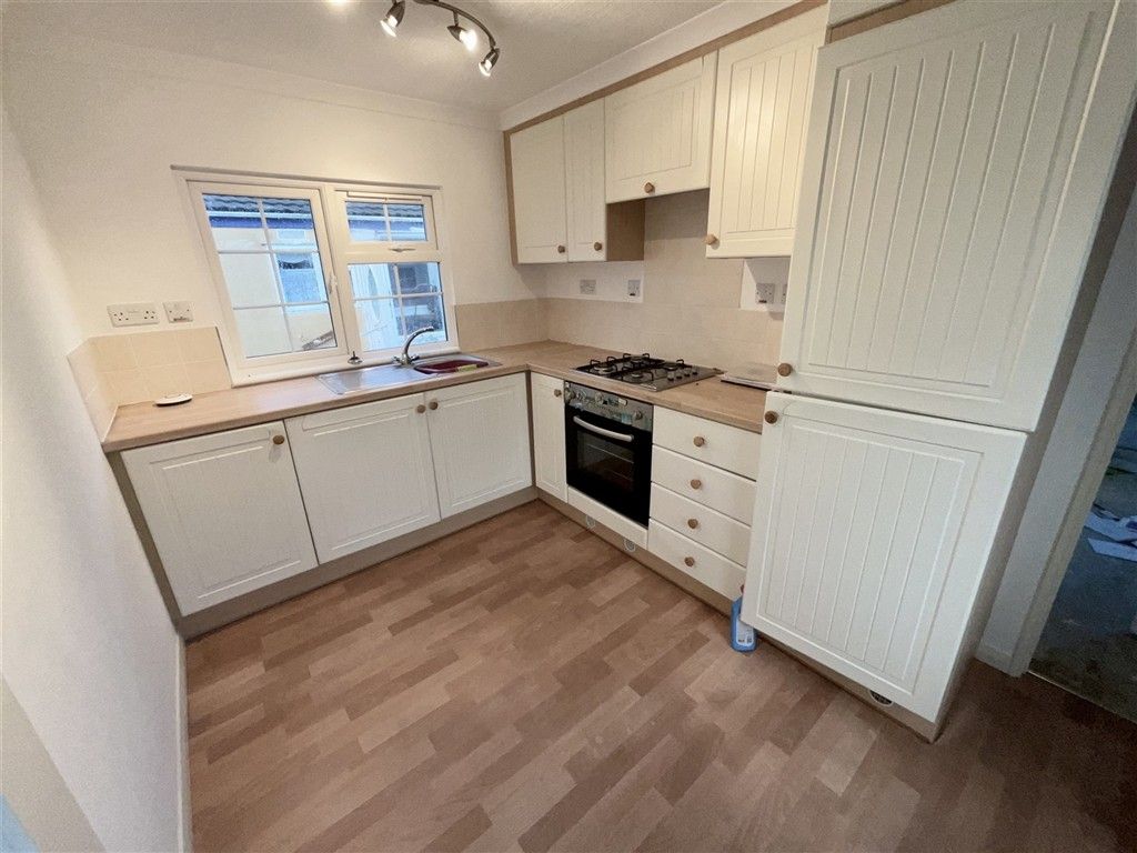 Property photo 2 of 6 Kitchen Area