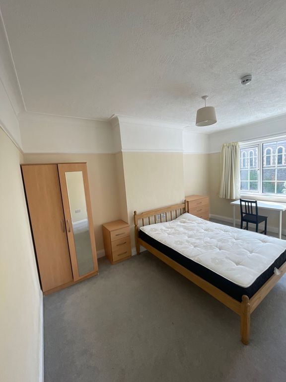 Property photo 3 of 10 A Bright Double Bedroom Featuring A Wooden Bed Fra...