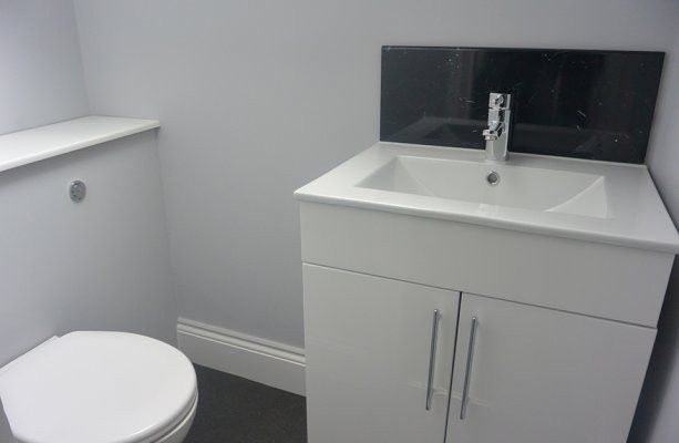 Property photo 3 of 7 A Modern, Clean Bathroom Featuring A White Sink Un...