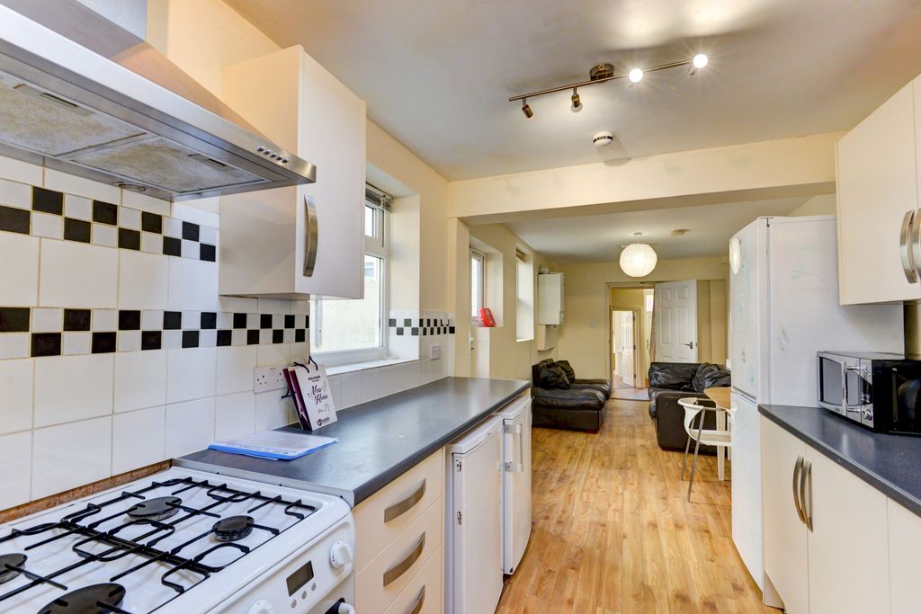 Property photo 2 of 13 A Bright, Welcoming Living Room Featuring Comforta...