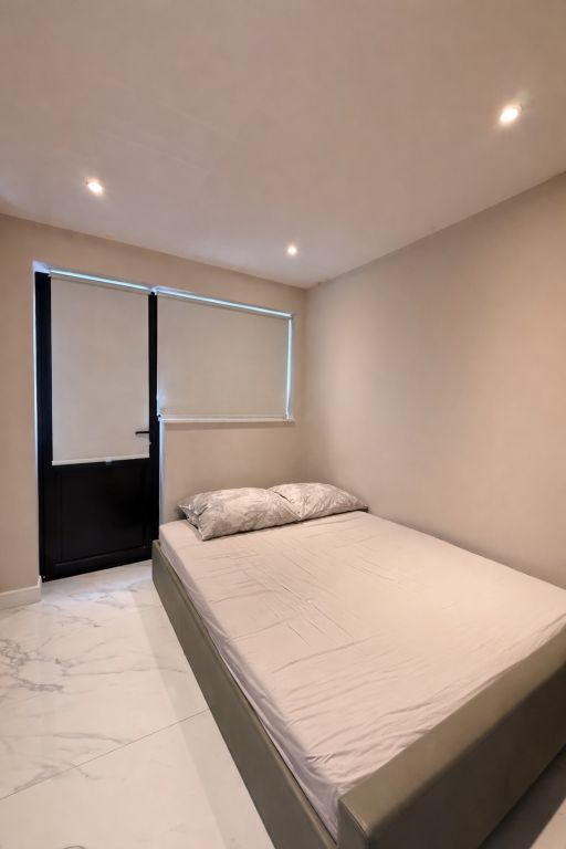 Property photo 3 of 4 Minimalist Bedroom With Simple Bed