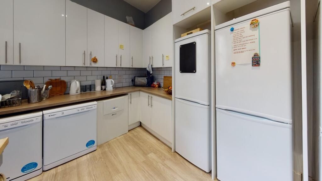 Property photo 3 of 10 A Modern Kitchen Featuring Sleek Cabinetry, Ample ...