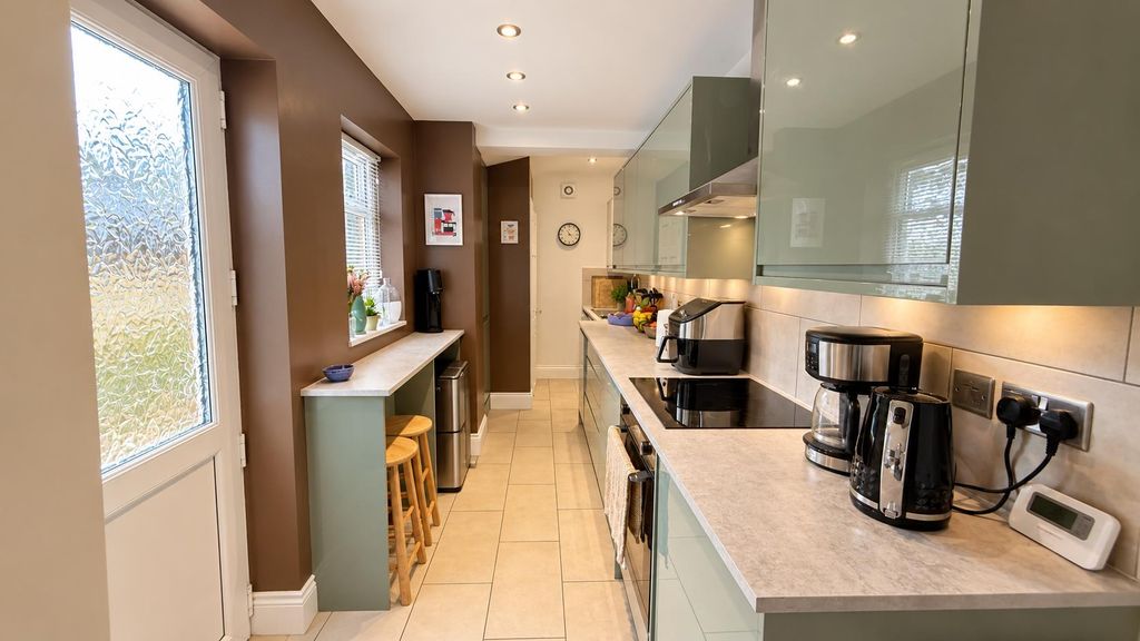 Property photo 2 of 16 Bright Sage-Green Galley Kitchen Perspective.Png