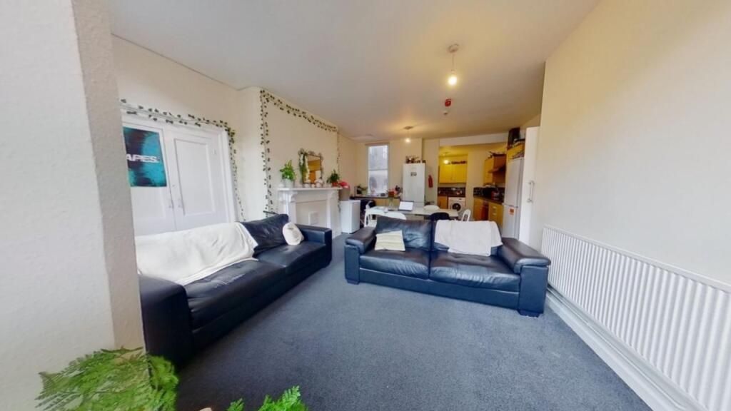 Property photo 3 of 15 Bright And Inviting Living Room Featuring Comforta...