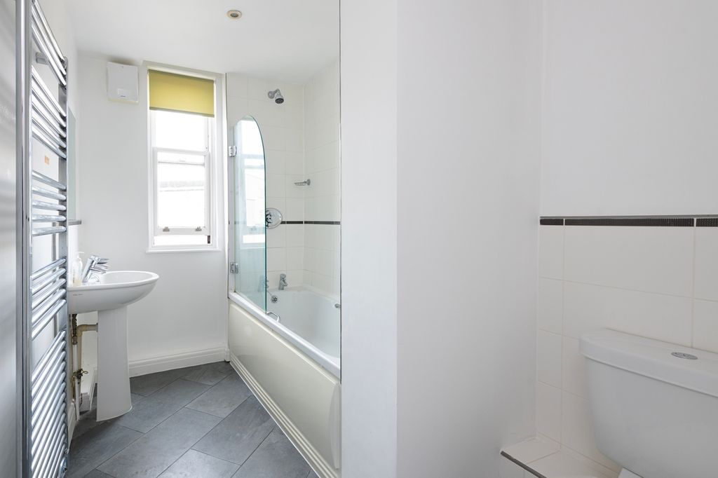 Property photo 2 of 7 A Spacious And Bright Large Bathroom Featuring A B...