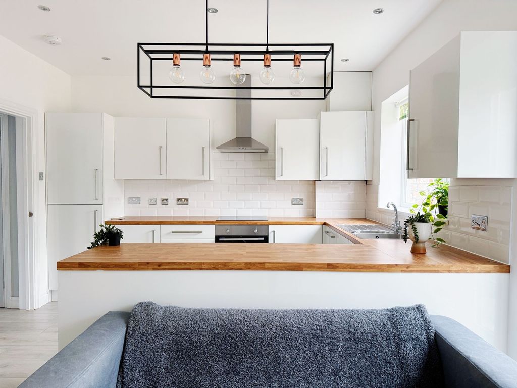 Property photo 3 of 10 Bright Modern Kitchen With White Cabinetry, Wooden...