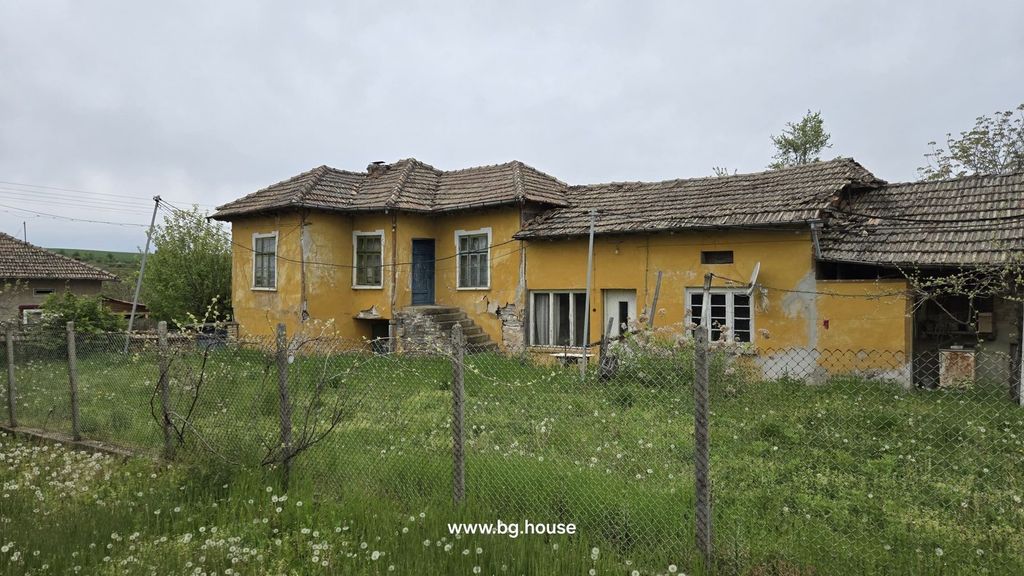 Property photo 1 of 31 Front View Of A Yellow Rural House With A Tiled Roof And Stone Steps Leading To The Entrance, Enclosed By A Wire Fence With Green Grass And Dandelions