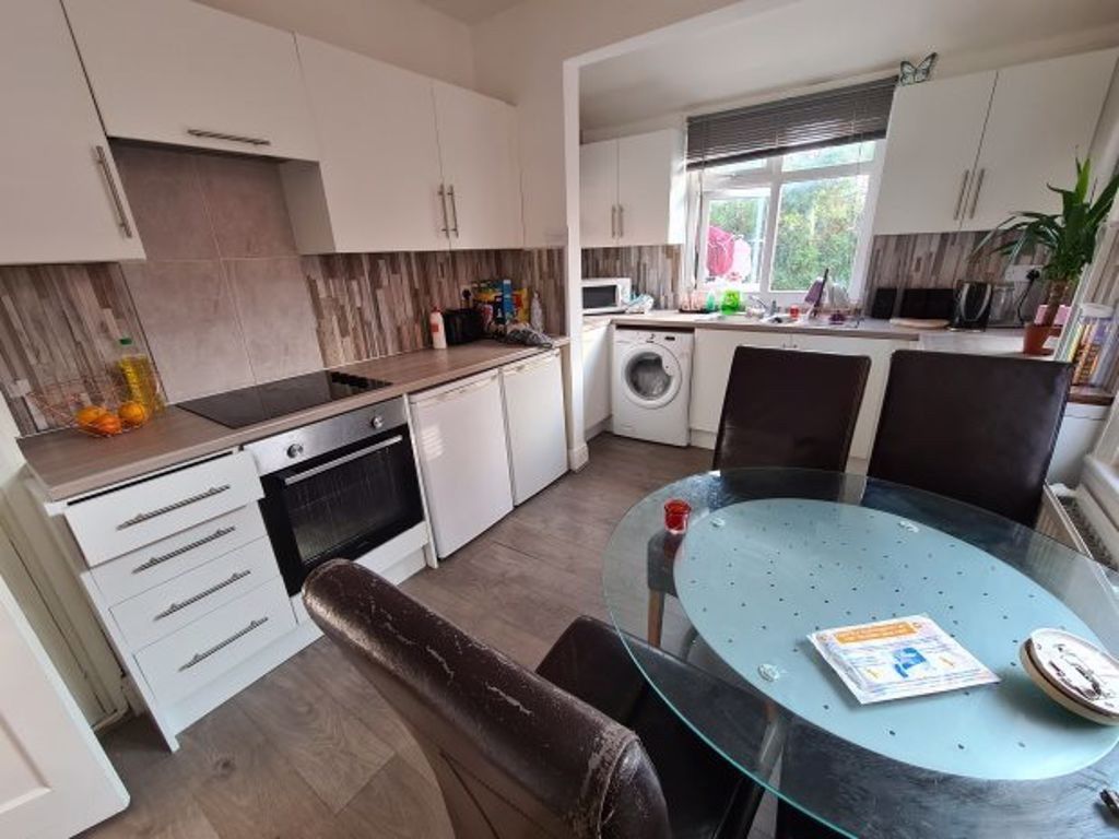 Property photo 2 of 10 A Modern, Well-Lit Kitchen With White Cabinetry, l...