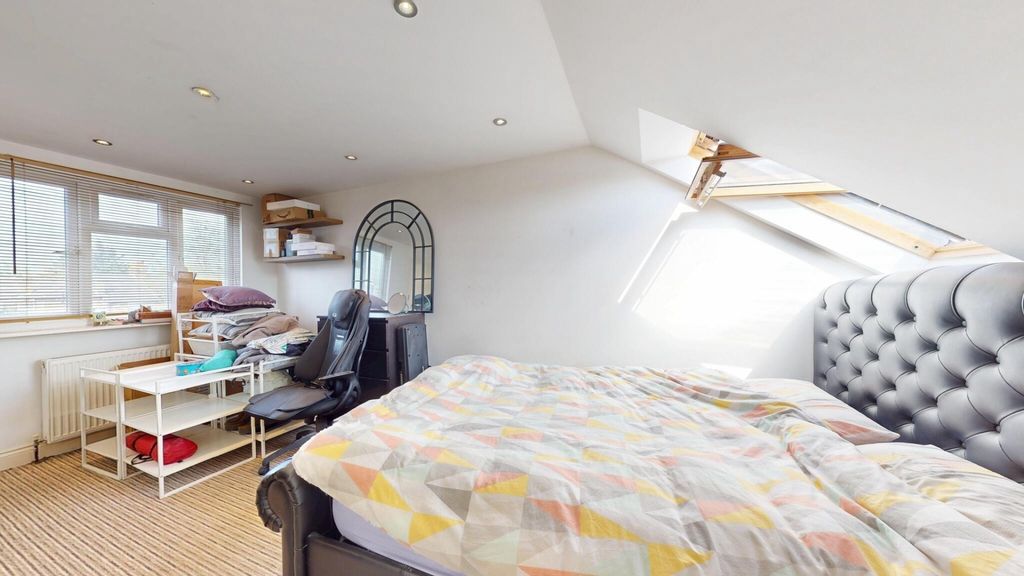 Property photo 2 of 15 Bright And Cozy Attic Bedroom Featuring A Comforta...