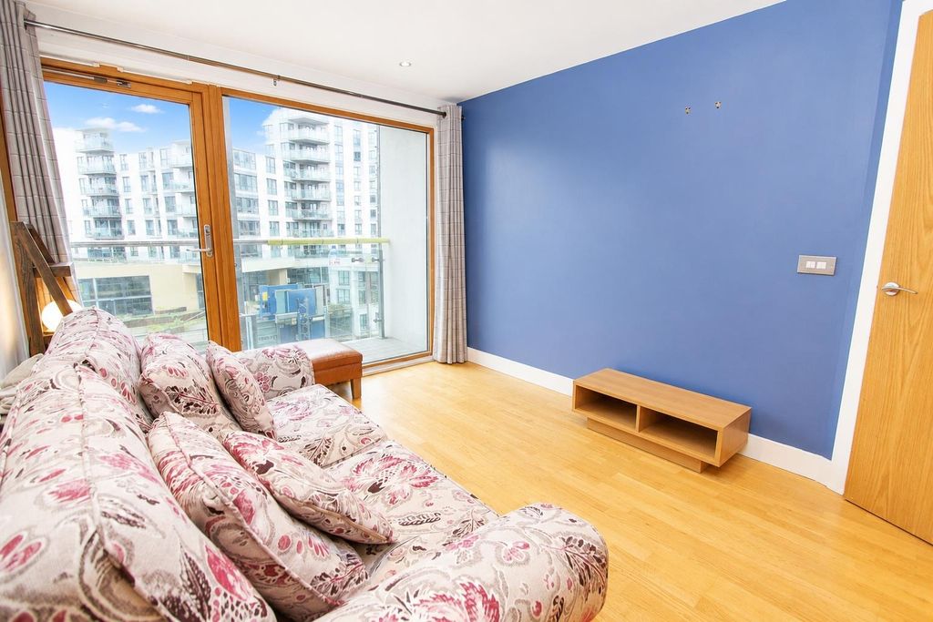 Property photo 2 of 8 Bright Lounge With Large Windows And Balcony Acces...